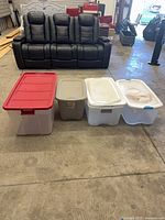 All four totes lined up with lids attached or beside them