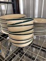Stack of bowls and two plate stacks showing color and rim detail