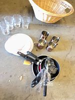Group shot showing mugs, cookware, glasses, dish stack and basket