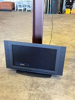 Front view of Olevia 32-inch LCD HDTV powered on showing 'No Signal' message