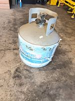 Front view of AmeriGas propane tank showing label wear and valve