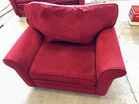 Front view showing entire armchair, cushions, arm style and upholstery