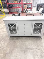 Front view showing drawers, glass doors and hardware