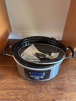 Front view of Hamilton Beach slow cooker showing digital control panel and stainless steel body