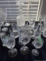Group shot showing decanter, tumblers, wine goblets, and cordial glasses