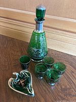 Full set showing decanter, five shot glasses, and leaf dish