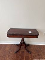 Full view of closed games table against wall