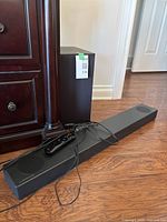 Soundbar, subwoofer, remote and cables overview