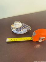 Top and side view showing tape measure indicating roughly 5 inch length