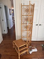 Folding screen, side table and faux florals grouped together
