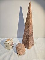 Obelisk, paperweight, and shell box grouped