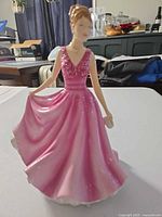 Front view of Rosemary figurine showing pink dress and detailing