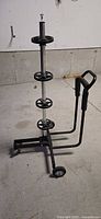 Side view of tire storage cart showing support discs, handle and base