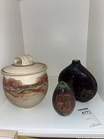 All three pieces side by side on shelf