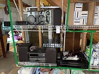 Shelf with Philips, Denon and Teac audio components and speakers