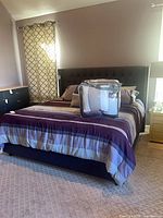 Full king bed setup showing headboard, rails, footboard, mattresses