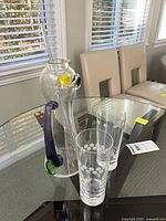 Full set on table: bird-form pitcher with stirrer and two tumblers