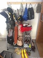 full view of rack with bags, clubs, hanging accessories