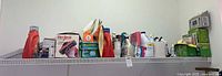 Wide view of cleaning supplies and small appliances on shelf