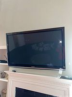 Front view of Panasonic TC-P54G10 mounted above fireplace