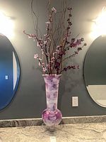 Full view of vase with arrangement on countertop