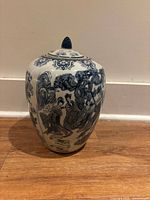 Full view of urn showing shape and decorative scene