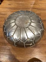 Full view of silver Moroccan pouf ottoman