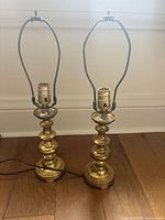Front view of both matching brass lamps with harps attached
