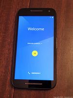 Phone powered on displaying welcome screen