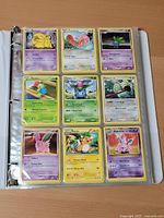 binder page showing nine yellow-border Pokémon cards including Slowpoke, Lotad, Budew, Venusaur line, Nidoran evolution line