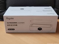 Front of boxed Rigate ultrasonic cleaner showing product image and branding