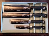 Knives with blade guards showing names and sizes