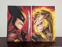 Both Wolverine and Sabretooth sketch cards side by side