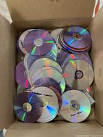 Top view of box filled with mixed CD-R and DVD-R discs