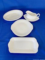 Group shot of all four Paragon white serving pieces