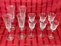 Front view of all ten crystal glasses showing two sizes