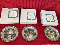Three collector plates with boxes and COAs