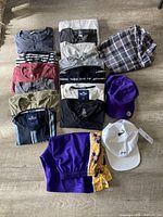 All items laid out: T-shirts, shorts, caps