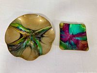 Free-form round tray beside square dish on white background