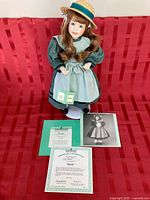 Full set: doll on stand with documents displayed