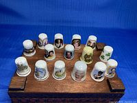All 15 bone china royal thimbles on stand