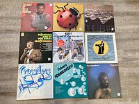 Group shot of nine LPs laid out 3×3