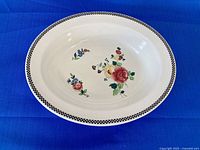 Top view of Wedgwood oval bowl showing floral pattern and check rim