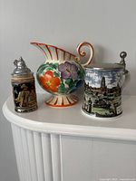 Group shot showing both steins and floral jug