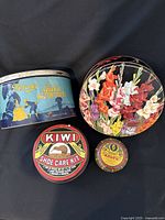 All four tins front view