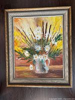 Front view of framed floral oil painting showing subject, colors, signature, and frame