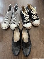 Top view of the three pairs arranged side by side showing uppers and laces