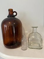 Amber jug, Listerine bottle, Patron bottle side by side