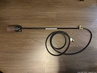 Full view of weed torch with hose coiled