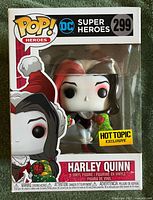 Front of boxed Funko Pop Holiday Harley Quinn figure showing number, branding, Hot Topic sticker
